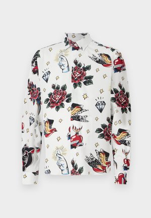 Long-sleeve shirt featuring a white base adorned with colorful tattoo-inspired patterns, including roses, diamonds, and birds.