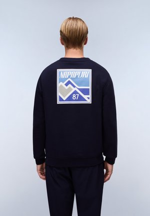 Navy blue sweatshirt with ribbed cuffs and hem, featuring a large multicolored mountain graphic and logo on the back. Soft fabric texture.