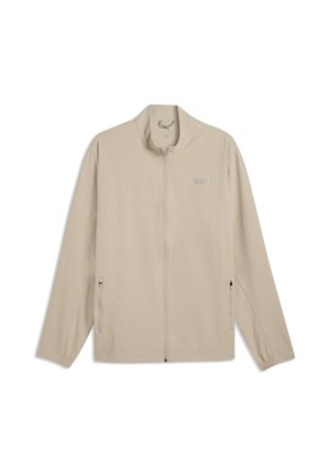 Beige jakke med fuld lynlås, lange ærmer, ståkrave, to frontlommer med lynlås og elastiske manchetter, vist på hvid baggrund.