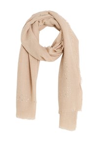 Bufanda beige hecha de un tejido suave y texturizado con bordes deshilachados. Presenta acentos metálicos dispersos en forma triangular a lo largo de un lado.