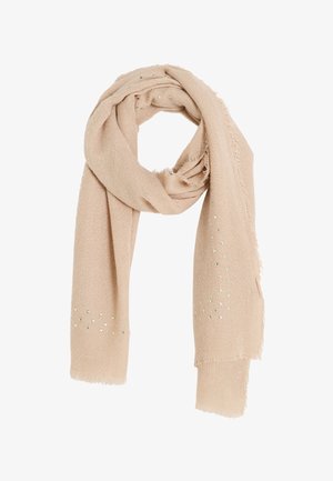 Bufanda beige hecha de un tejido suave y texturizado con bordes deshilachados. Presenta acentos metálicos dispersos en forma triangular a lo largo de un lado.