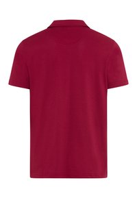 Vue arrière d'un polo bordeaux uni à manches courtes avec col plié, sans logos ni motifs visibles.