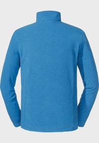 Niebieski polarowy półgolf, z długimi rękawami i miękką fakturą; charakteryzuje się minimalnym szyciem i brakiem widocznych elementów metalowych.
