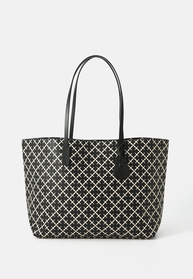 Black and cream patterned tote bag with long handles, featuring a geometric design, smooth texture, and a small attached tag.