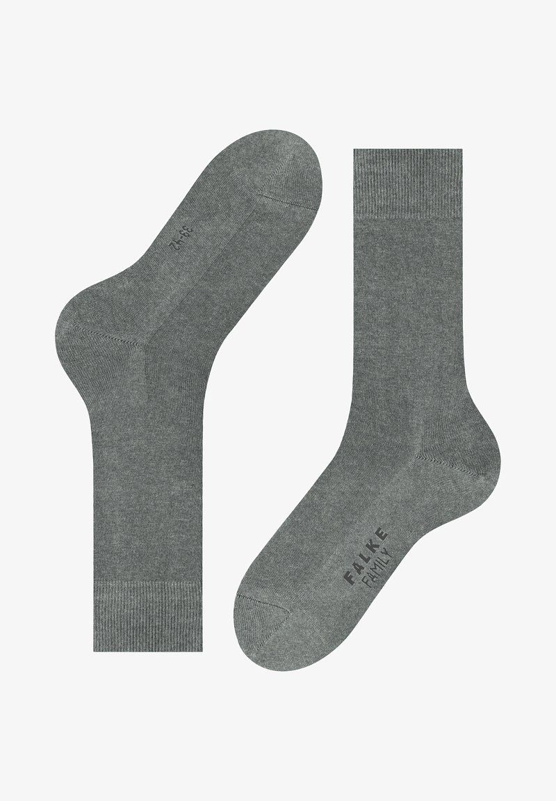 Grå strumpor med ribbade muddar och förstärkta tår. Mjuk textur, med märket "FALKE" tryckt på undersidan av en strumpa.