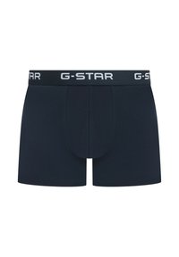 Boxers bleu marine foncé en tissu respirant, avec une coupe ajustée et un logo G-STAR blanc contrastant sur la ceinture.