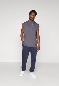 Champion ICONS CUFF PANTS - Treningo apatinė dalis - navy
