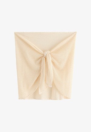 Beige åbenstrikket hæklet omslagsnederdel med knude foran, semitransparent tekstur og let, åndbart stof.