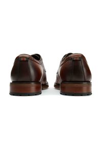 Brown leather shoes with a smooth finish, rounded design, and stacked heel. Features colorful accent stitching on the heel.