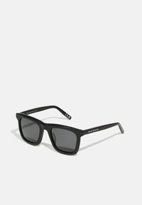 Black rectangular sunglasses with dark lenses, thick plastic frame, and straight arms. "Prive Revaux" printed in white on one arm.