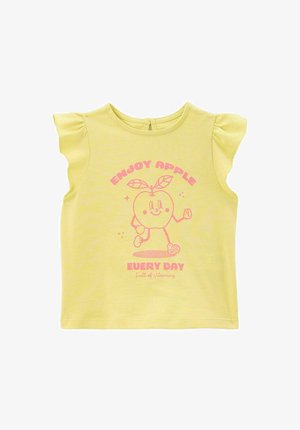 T-shirt jaune à manches courtes avec des manches à volants. Présente un graphisme rose d'une pomme souriante et le texte "PROFITEZ DE LA POMME TOUS LES JOURS."