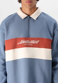 Santa Cruz FLAME UNISEX - Pusa - dusty blue