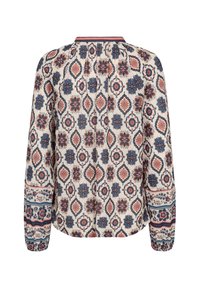 Blouse met lange mouwen, voorzien van een bloemen- en geometrisch patroon in marineblauw, rood en crème. Geraffineerde halslijn en elastische sluitingen. Lichtgewicht stof.