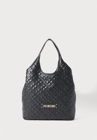 Black quilted leather tote bag with single shoulder strap and gold "Love Moschino" logo plaque on front.