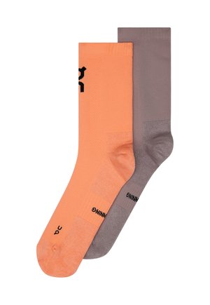 Two pairs of textured crew socks, one bright orange and one muted gray, displayed flat and overlapping on a white background.