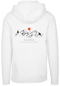 White hoodie featuring a mountain range graphic, an orange sun, and the text "ESCAPE AND DISCOVER THE WORLD" in black.