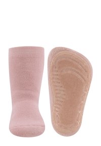 Różowe bawełniane skarpetki z textured przeciwdziałającą śliskości podeszwą. Żebrowany wzór, dopasowany kształt oraz lekkie wyściełanie w okolicy palców i pięty dla komfortu.