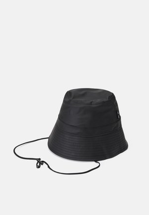 Black bucket hat made of smooth, water-resistant material. Features a flat top, wide brim, and adjustable drawstring for secure fit.