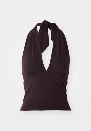 Top halter dans un violet foncé, en tissu lisse. Présente un décolleté en V profond et des détails froncés sous la poitrine. Se noue autour du cou.
