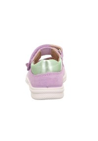 Purple suede children's sandal with green heel patch, adjustable Velcro strap, and white textured sole, viewed from the back.