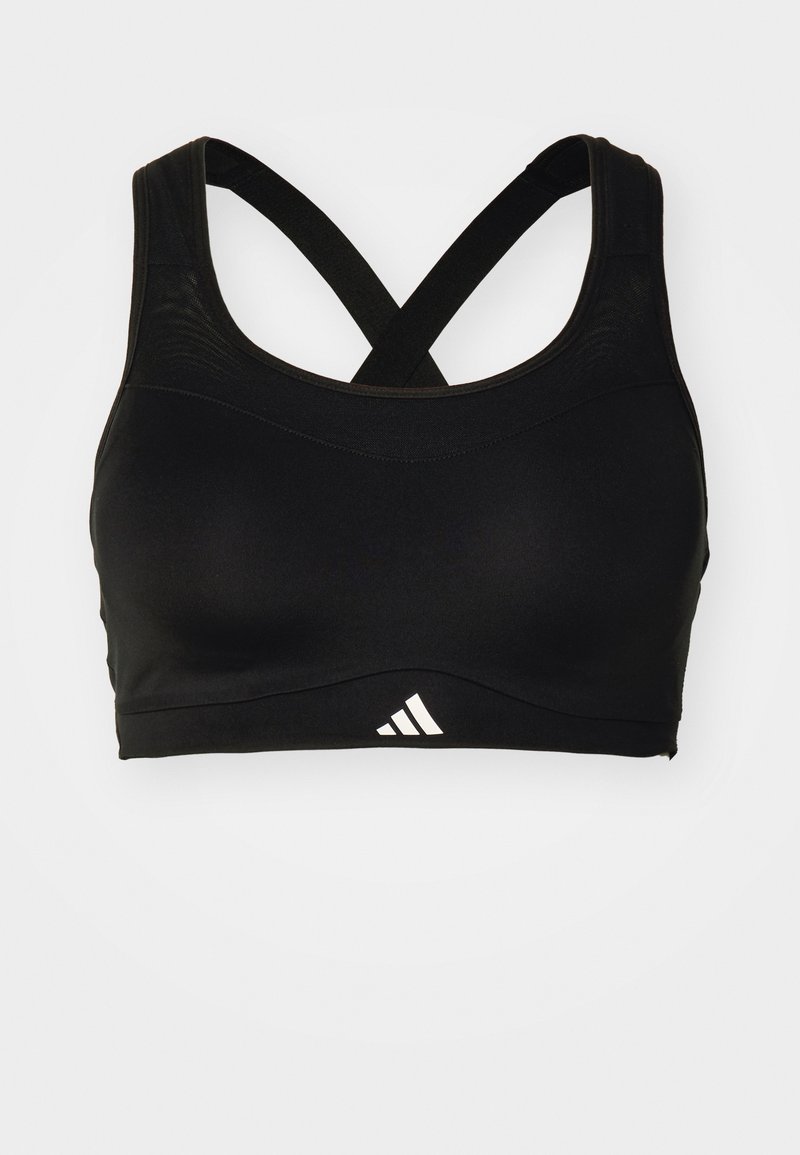 Top sportivo nero con una texture liscia, spalline incrociate e logo Adidas bianco sulla parte anteriore. Progettato per l'abbigliamento attivo.
