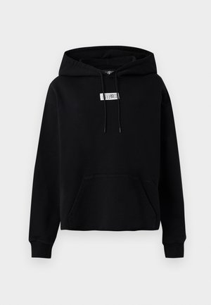 Black pullover hoodie made from cotton, featuring a front pocket, adjustable drawstring, and a small logo patch on the chest.