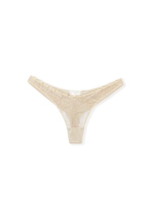 Beige string gemaakt van doorschijnende kant met golfpatroon en satijnen details. Heeft dunne bandjes en een klein uitsnijding aan de achterkant.