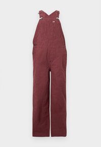 Salopette bordeaux en coton, avec des bretelles croisées dans le dos, des poches avant et des accents en métal. Texture lisse et coupe décontractée.