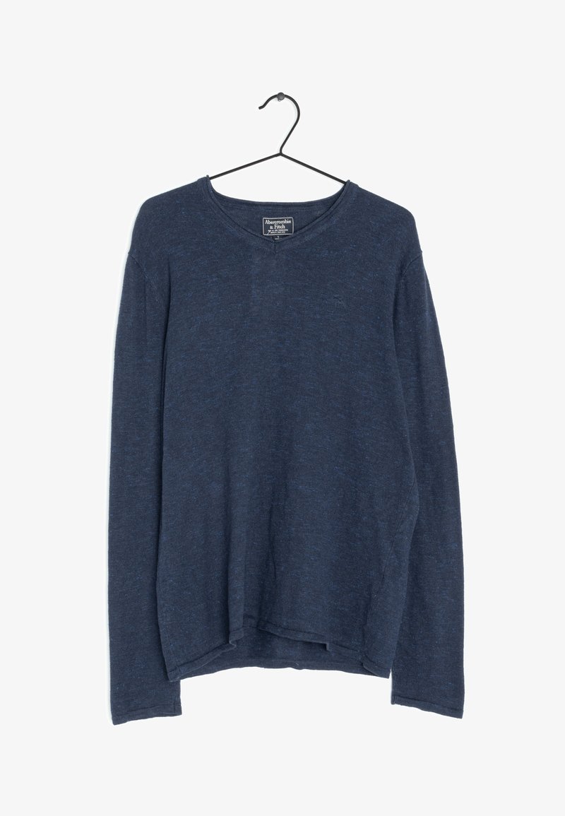 Navy long-sleeve shirt made of a textured knit fabric, featuring a crew neckline and a relaxed fit, with a straight hem and minimal branding.