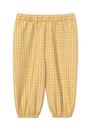 Luźne spodnie w żółto-białą kratę z elastycznym paskiem i marszczonymi elastycznymi mankietami przy kostkach.