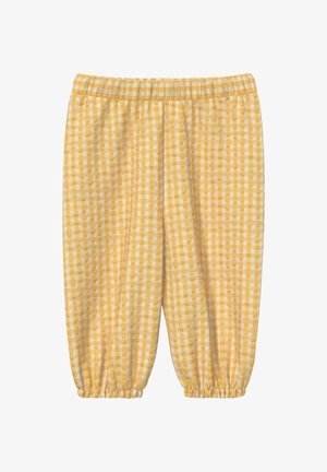 Pantaloni a quadretti gialli e bianchi a vestibilità ampia con vita elastica e polsini elastici arricciati alle caviglie.