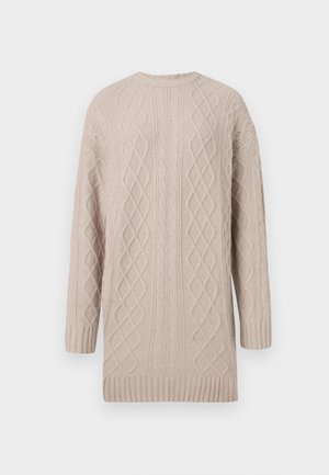 Μπέζ πλεχτό πουλόβερ με σχέδιο καμπύλης, μακριά μανίκια, στρογγυλή λαιμόκοψη και ριπ τελείωμα. Μαλακή υφή και μέσο μήκος.