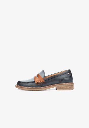 Læderloafers med en mørkeblå krop, brun accentrem og dekoreret syning. Tekstureret sål og lille hæl for en ekstra stil.