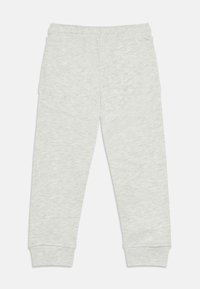 Ανοιχτό γκρι παντελόνι φόρμας με ελαστική μέση, ριμπ μανσέτες και μαλακό, υφασμάτινο ύφασμα με υφή. Διαθέτει πλαϊνές τσέπες για λειτουργικότητα.