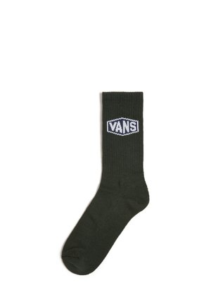Olivgrüne Baumwollsocke im Crew-Stil mit gerippter Textur und weißem "VANS"-Logopatch auf der Vorderseite. Standardlänge mit verstärkter Zehenpartie.