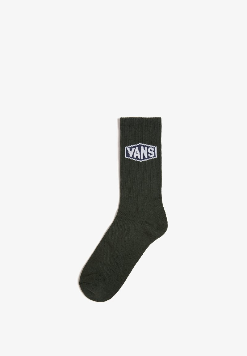 Olivgrüne Baumwollsocke im Crew-Stil mit gerippter Textur und weißem "VANS"-Logopatch auf der Vorderseite. Standardlänge mit verstärkter Zehenpartie.