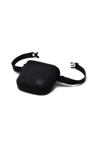 Borsa a tracolla nera in tessuto con zip superiore, cinturino regolabile e una piccola etichetta del logo. Forma compatta e rettangolare con una superficie liscia.