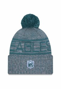 Cappello lavorato a maglia in teal e grigio con un motivo testurizzato e un pom-pom sulla parte superiore, caratterizzato da un patch con il logo NFL sul risvolto.