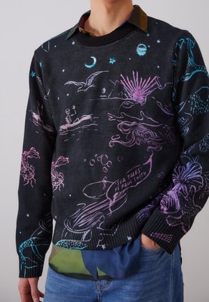 Black sweater with colorful sea creatures, skeleton in boat, moon, stars, and "Sea Tales PS Paul Smith" text, worn over a dark shirt.
