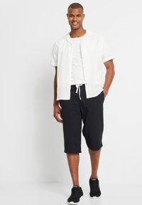 bonprix BERMUDA - Pantaloni sportivi - black