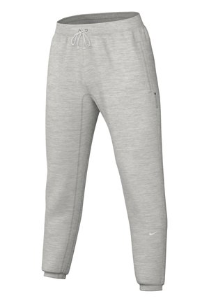 Gaiši pelēki sporta bikses, kas izgatavotas no mīksta auduma, ar elastīgu jostu ar auklu, sānu kabatām un sašaurinātiem piedurkņu galiem. Attēlota Nike logo.