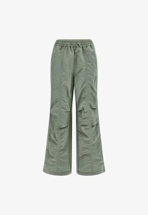 Svetlozelené nohavice zo zmesi nylonu s širokým strihom, elastickým pásom a bočnými vreckami. Majú hladkú textúru a voľný strih.