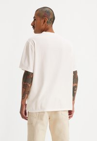 Levi's® BUTTON HENLEY - Pamata T-krekls - cloud dancer