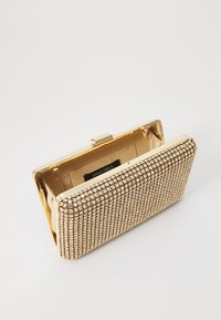 Gold clutch with a rectangular shape, covered in small, clear rhinestones. Interior is lined in beige fabric with a snap closure.