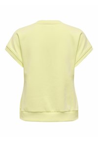 Chemise à manches courtes jaune pâle avec ourlet et poignets à côtes, vue de dos sur un fond blanc.