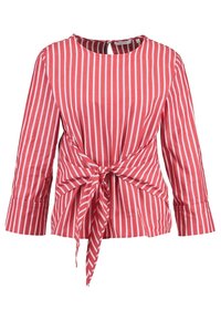 Blusa a righe rosse e bianche con maniche lunghe, scollatura rotonda e dettaglio anteriore legato. Realizzata in tessuto leggero con una finitura testurizzata.