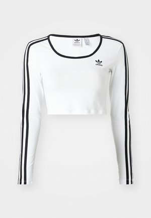 Weißes, langärmliges, kurz geschnittenes Oberteil mit schwarzen Streifen an den Ärmeln, rundem Ausschnitt und kleinem schwarzen Logo auf der Brust. Glatter Stoff.