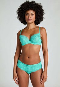 Türkisfarbener Spitzen-BH und passende Pantys mit Blumenmustern, weicher Textur, verstellbaren Trägern und einer kleinen Zierschleife in der Mitte.