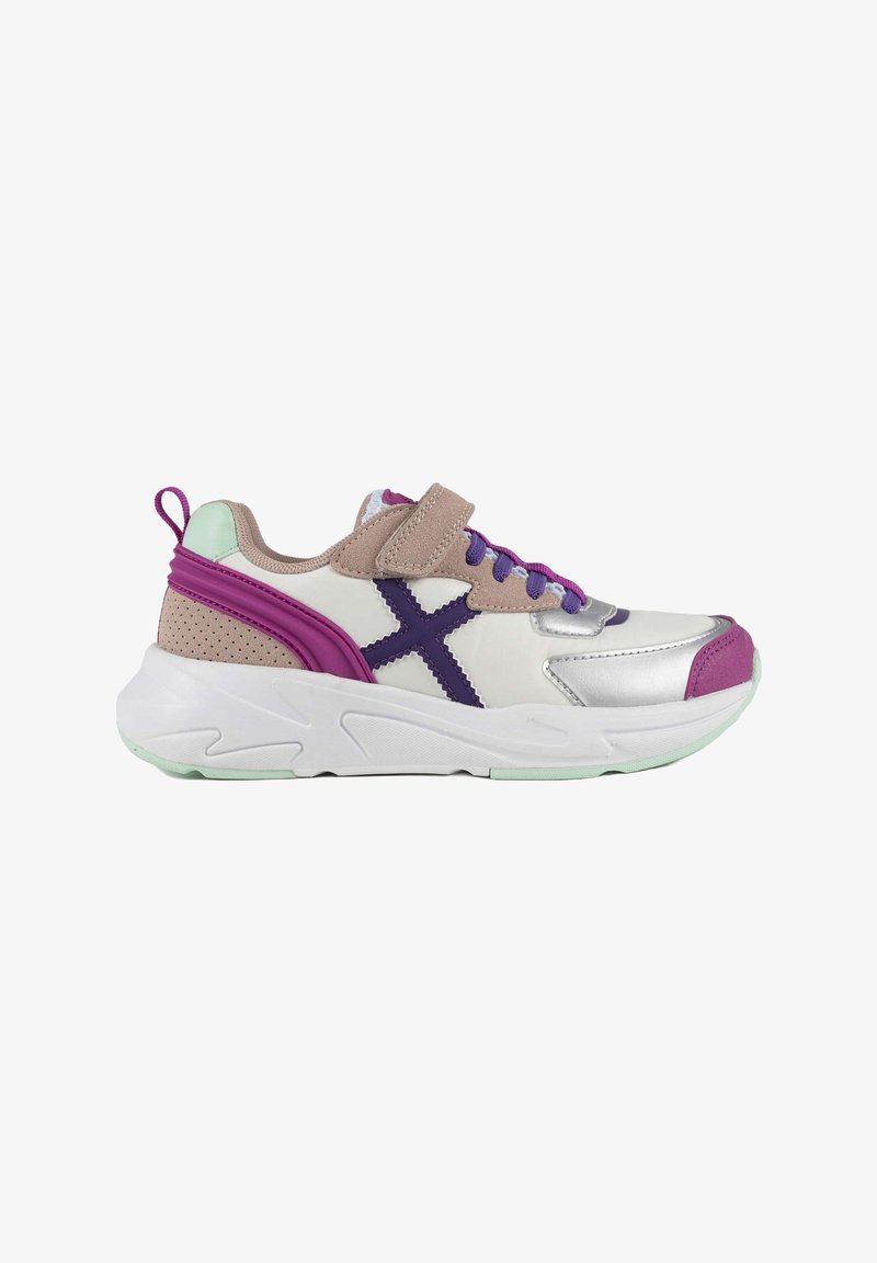 Sport shoes featuring a white synthetic upper with silver accents, purple and mint green details, a padded collar, and a velcro strap.