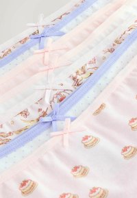Ensemble de sous-vêtements pour enfants aux couleurs pastel, avec de petits nœuds et des motifs comprenant des licornes et des gâteaux, disposés en rangées superposées.